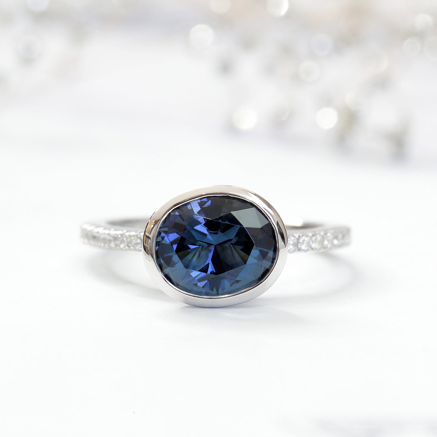 Platinum Plated Sterling Silver Simulated Blue Sapphire East West Ring