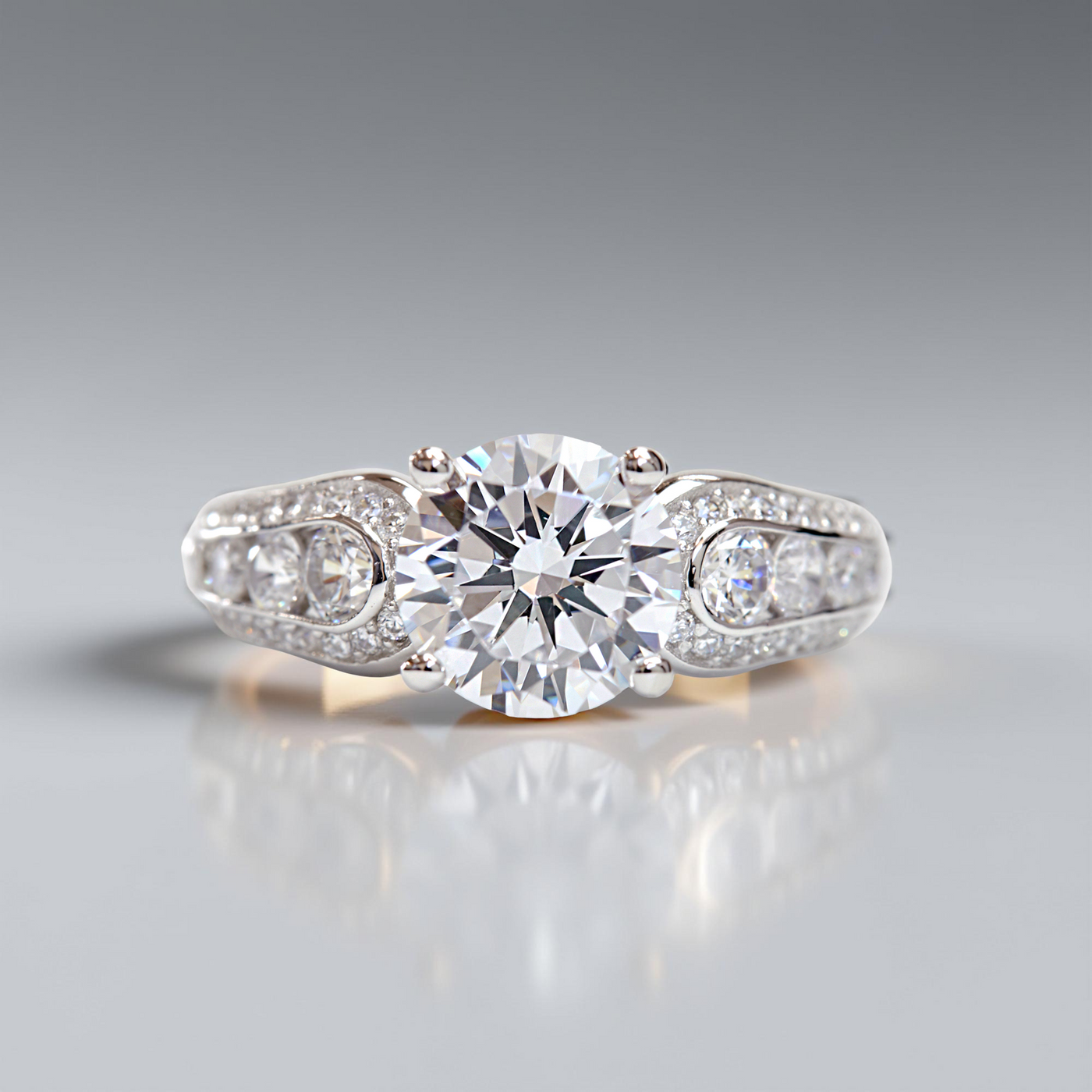 Promise in Progress Ring – 2 carat center stone with graduated channel-set accents