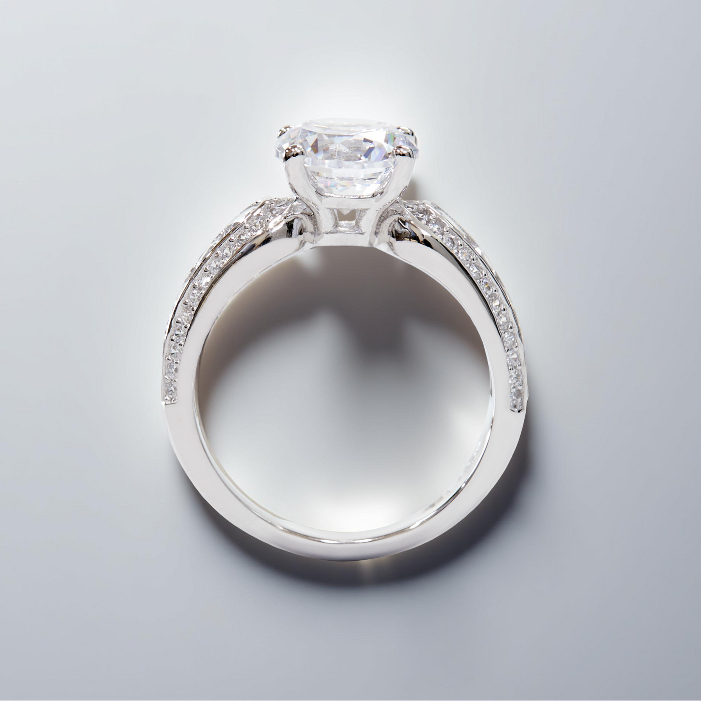 Promise in Progress Ring – 2 carat center stone with graduated channel-set accents