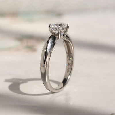 Side profile of solitaire ring showing 6-prong high setting and band taper