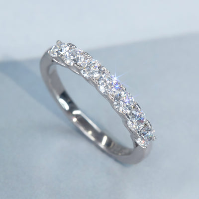Seven Moments Ring with seven round stones in silver band.