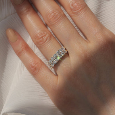 Hand wearing Seven Moments Ring, showing stacked and solo options.