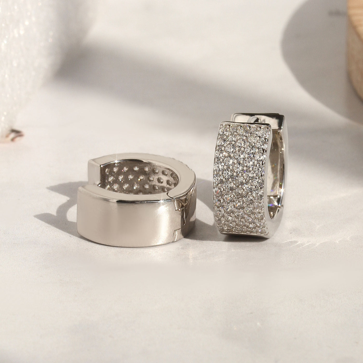 Wide sterling silver pave huggies with secure clasp design