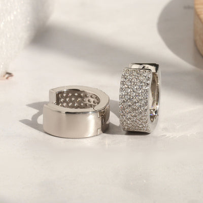 Wide sterling silver pave huggies with secure clasp design