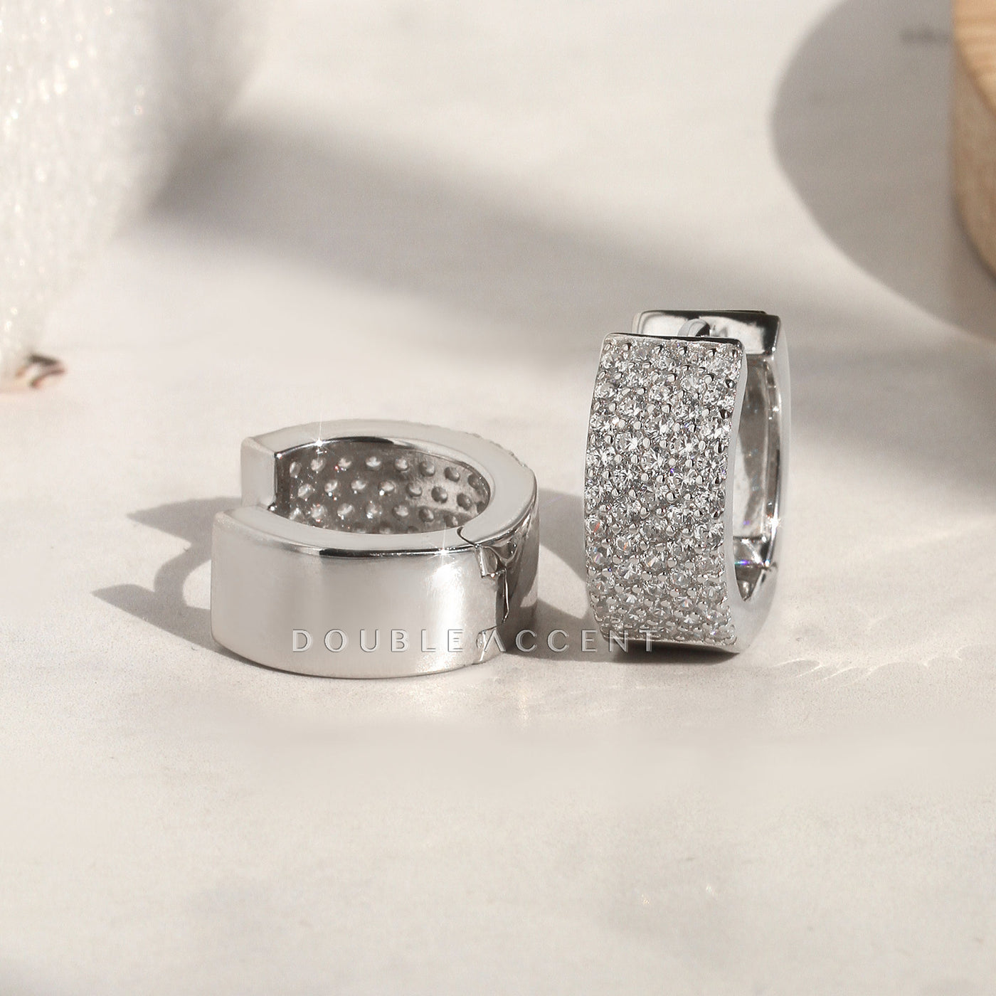 Wide sterling silver pave huggies with secure clasp design