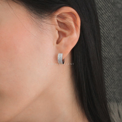 Wide sterling silver pave huggies with secure clasp design