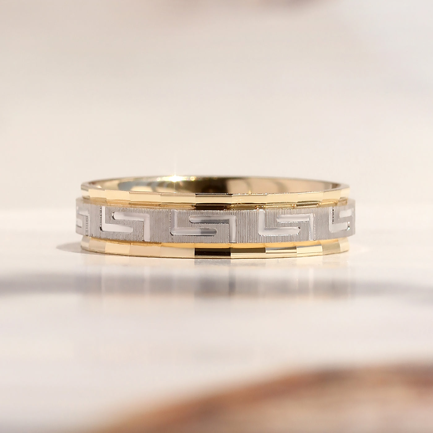 Duality Greek Key Band — two-tone 14K gold wedding ring with carved Greek Key eternity pattern
