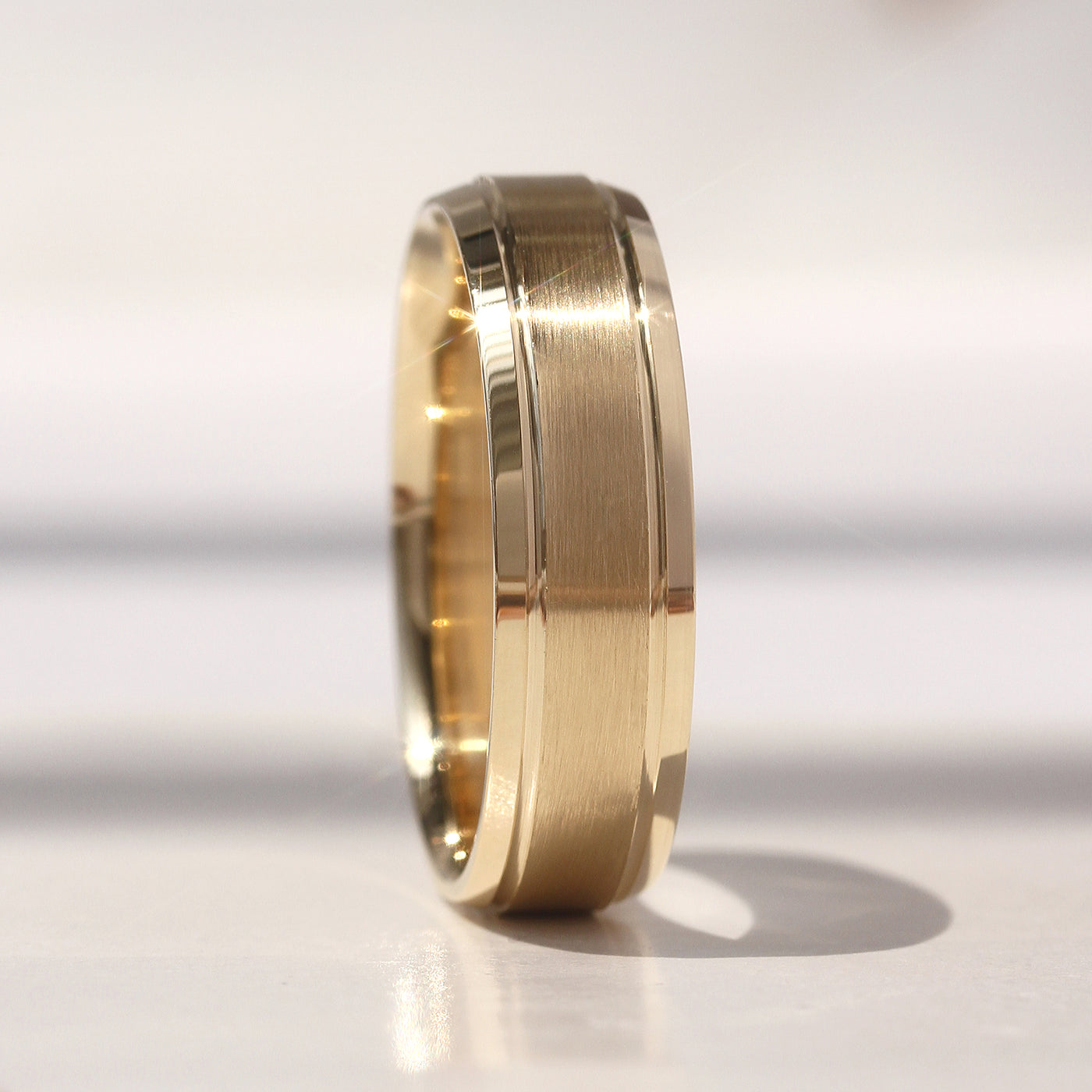 Matching 14K gold wedding bands featuring a matte center with polished grooved edges – Evermore Band Set by Double Accent