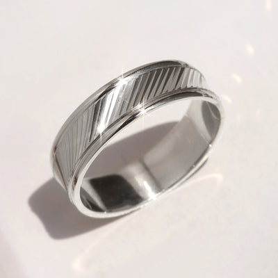 Goldrift Band Set — solid 14K white gold couple rings with diamond-cut diagonal pattern and comfort-fit interior
