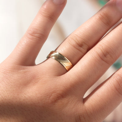 Goldrift Band Set — solid 14K gold couple rings with diamond-cut diagonal pattern and comfort-fit interior