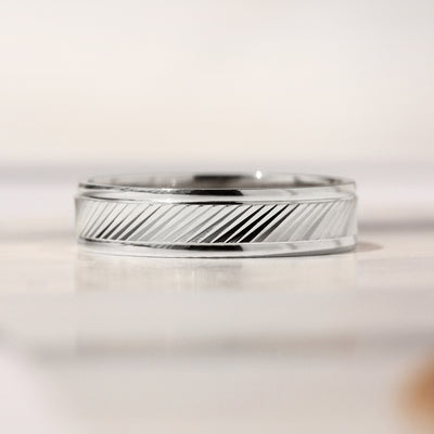 Goldrift Band Set — solid 14K white gold couple rings with diamond-cut diagonal pattern and comfort-fit interior