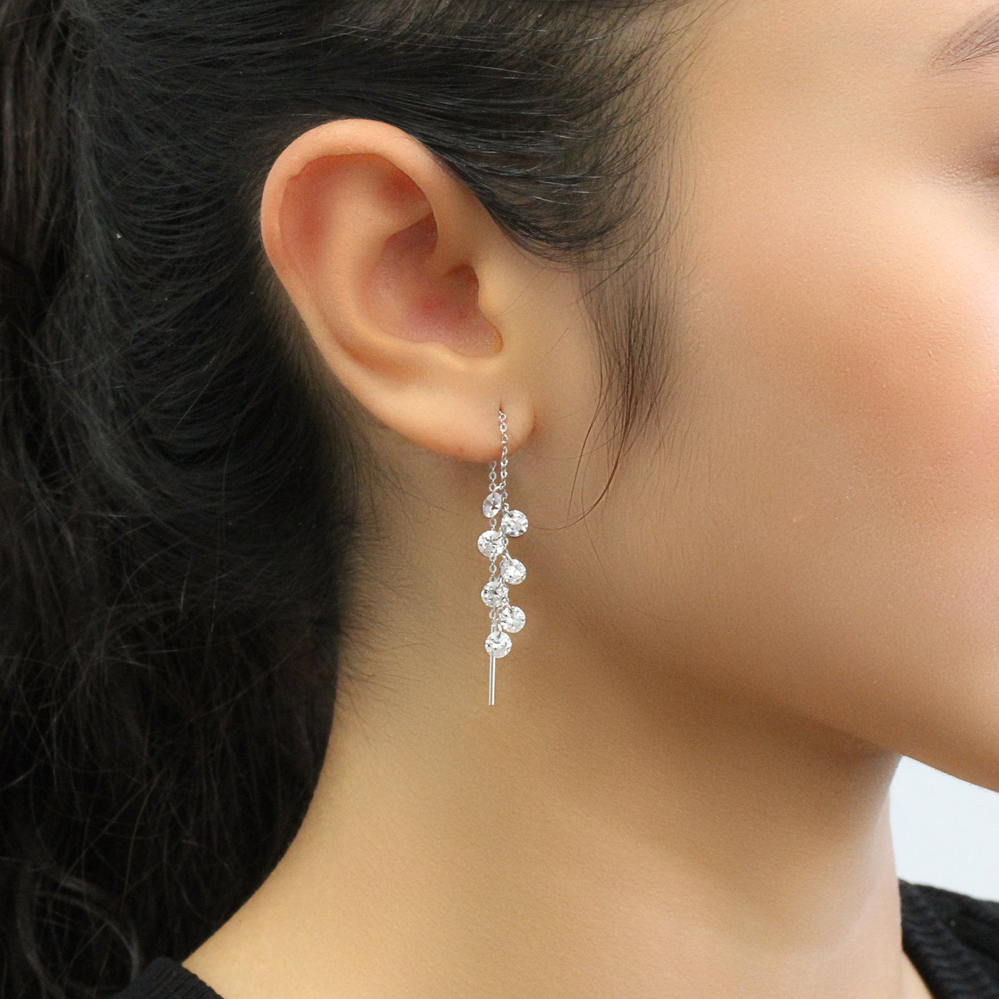 Close-up of Cascade Whisper seven-stone earrings