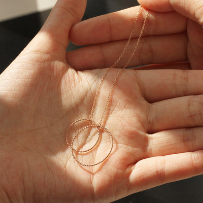 Long chain 14K rose gold threaders with twin circle design