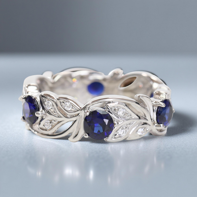 Silver ring with blue gemstones on a gray background