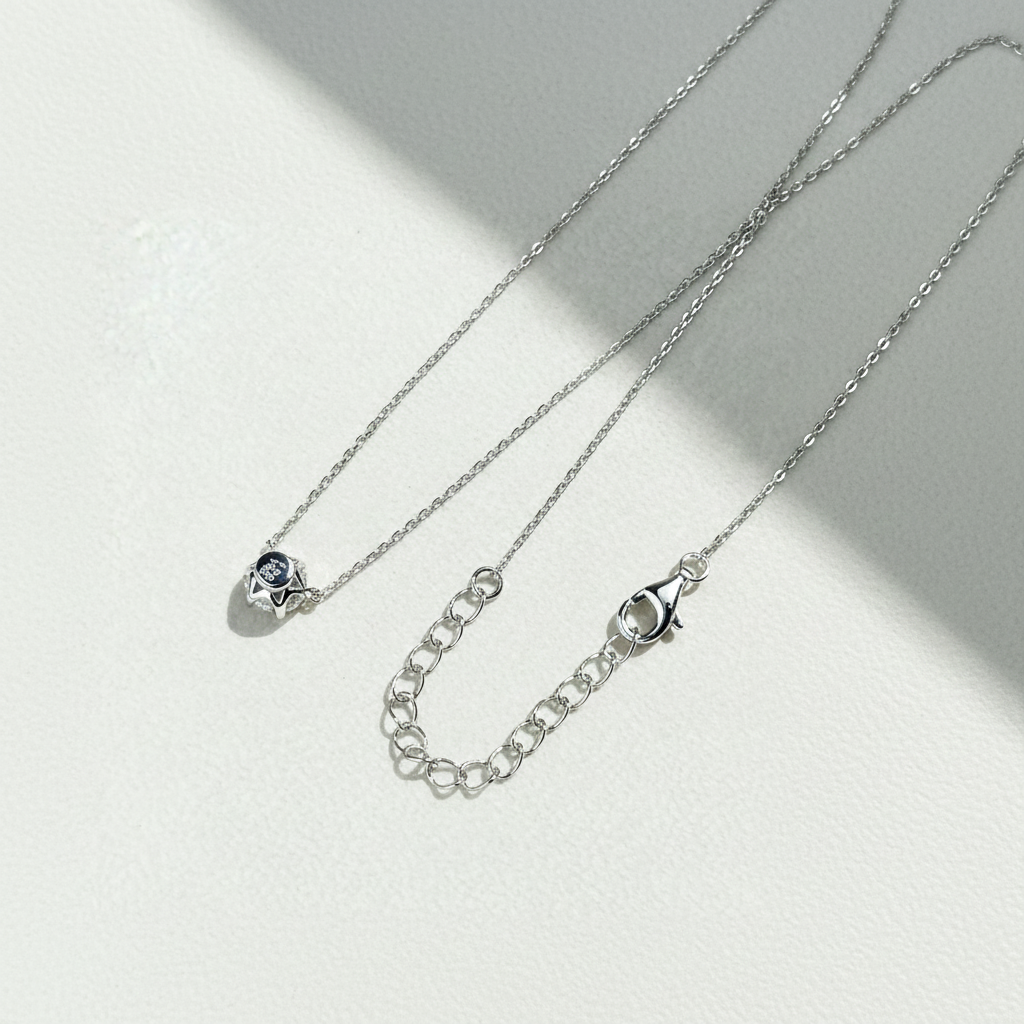 Close-up of six-prong CZ or moissanite stone on the Aura Solitaire Necklace.