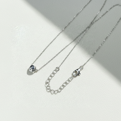 Close-up of six-prong CZ or moissanite stone on the Aura Solitaire Necklace.
