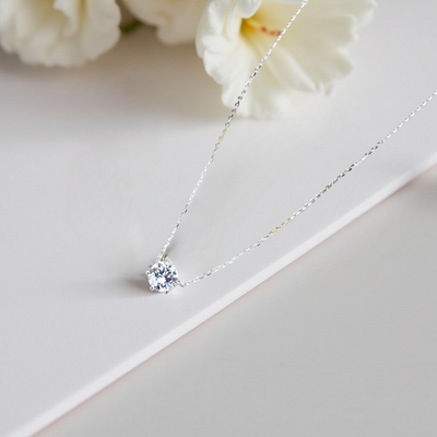 Aura Solitaire Necklace with six-prong solitaire stone in platinum-plated sterling silver.