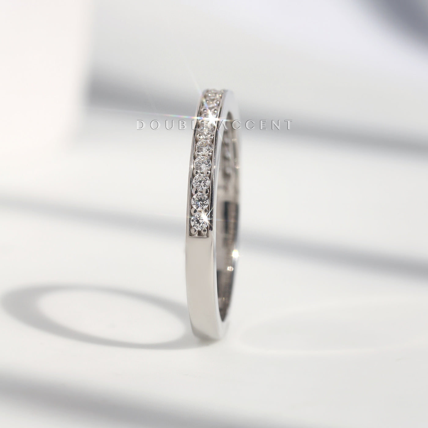 Close-up of half pavé eternity band