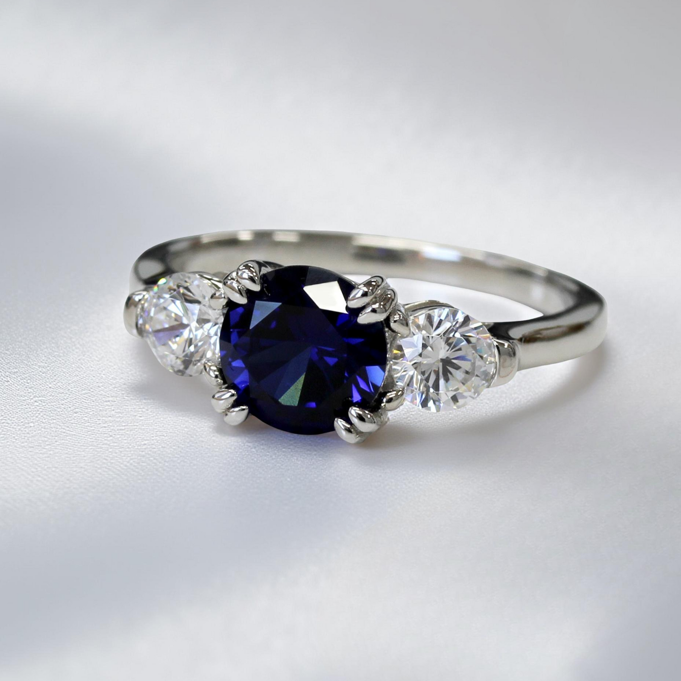 Sterling silver three stone promise ring with 2ct round blue spinel and cubic zirconia accents – Blue Breeze Promise Ring