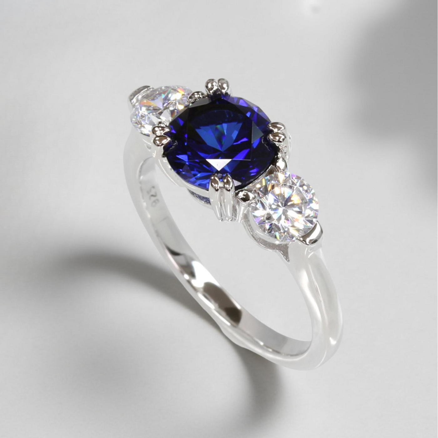 Sterling silver three stone promise ring with 2ct round blue spinel and cubic zirconia accents – Blue Breeze Promise Ring