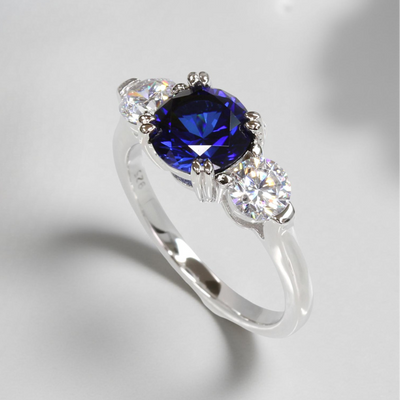 Sterling silver three stone promise ring with 2ct round blue spinel and cubic zirconia accents – Blue Breeze Promise Ring