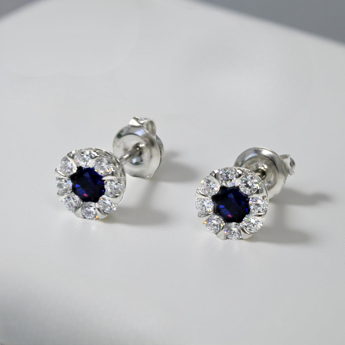 Platinum-plated sterling silver earrings with blue sapphire color cubic zirconia cluster stones – Calm Mindfulness Jewelry Set
