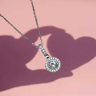 Amore Keeps Necklace on a pink background