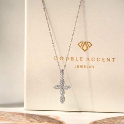 Silver cross necklace on a Double Accent Jewelry box