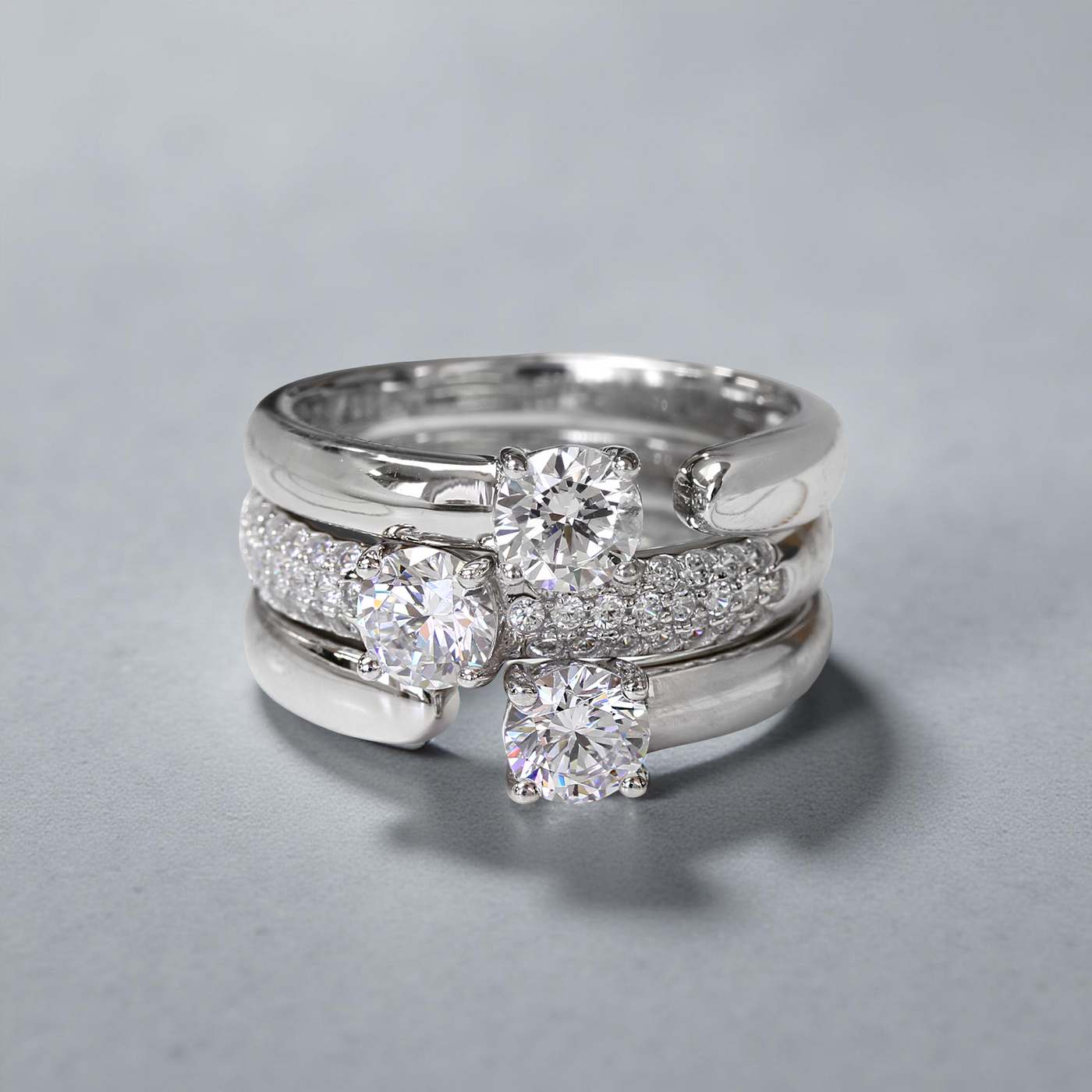 Three-ring open band set with center stones in platinum finish