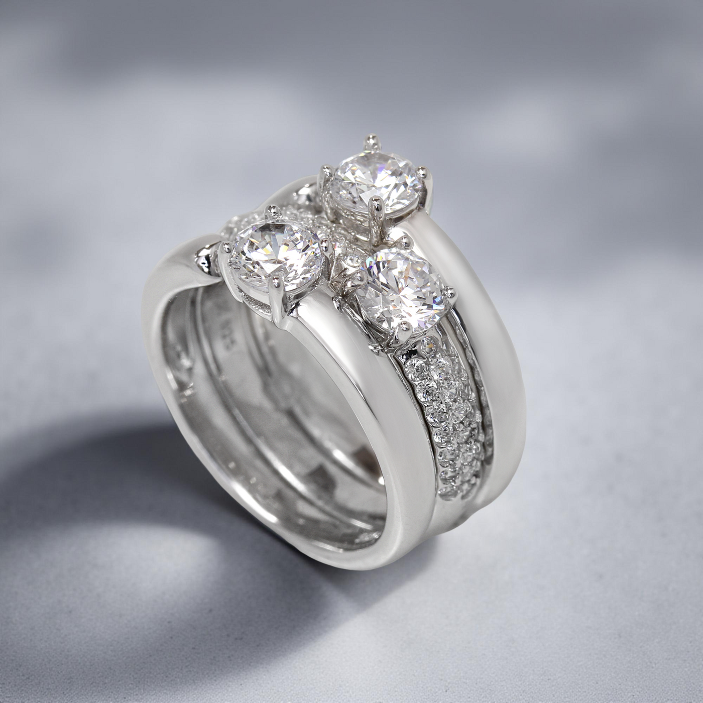 Three-ring open band set with center stones in platinum finish