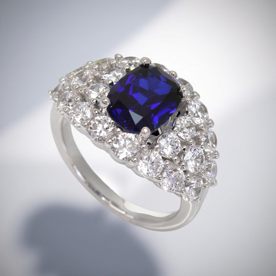 Platinum-plated sterling silver statement ring with 2.6ct cushion-cut blue spinel and cubic zirconia halo – Blue Majesty Cushion Ring