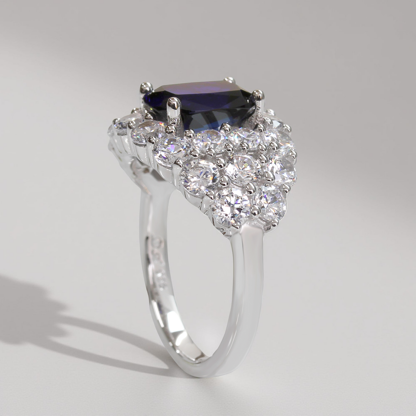 Silver ring with a central blue gemstone and diamond accents – Blue Majesty Cushion Ring