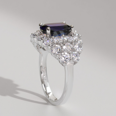 Silver ring with a central blue gemstone and diamond accents – Blue Majesty Cushion Ring