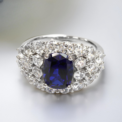 Ring with a blue gemstone and diamond-studded band – Blue Majesty Cushion Ring