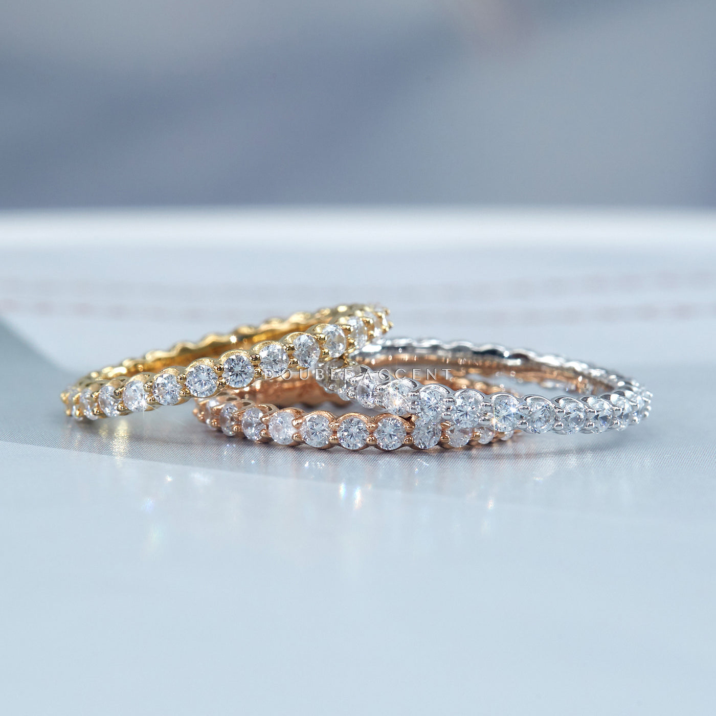 2.5mm eternity ring wedding band with prong-set stones in platinum, gold, and rose gold — Endless Love Eternity Ring