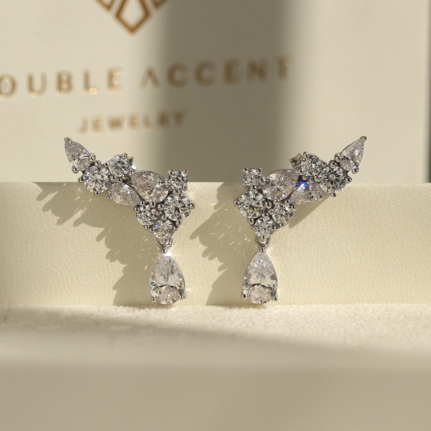 Sparkle Beyond the Aisle: CZ Cluster Angel Wing Earrings