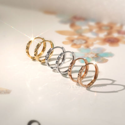 Light Aura Huggies in yellow, white, and rose gold