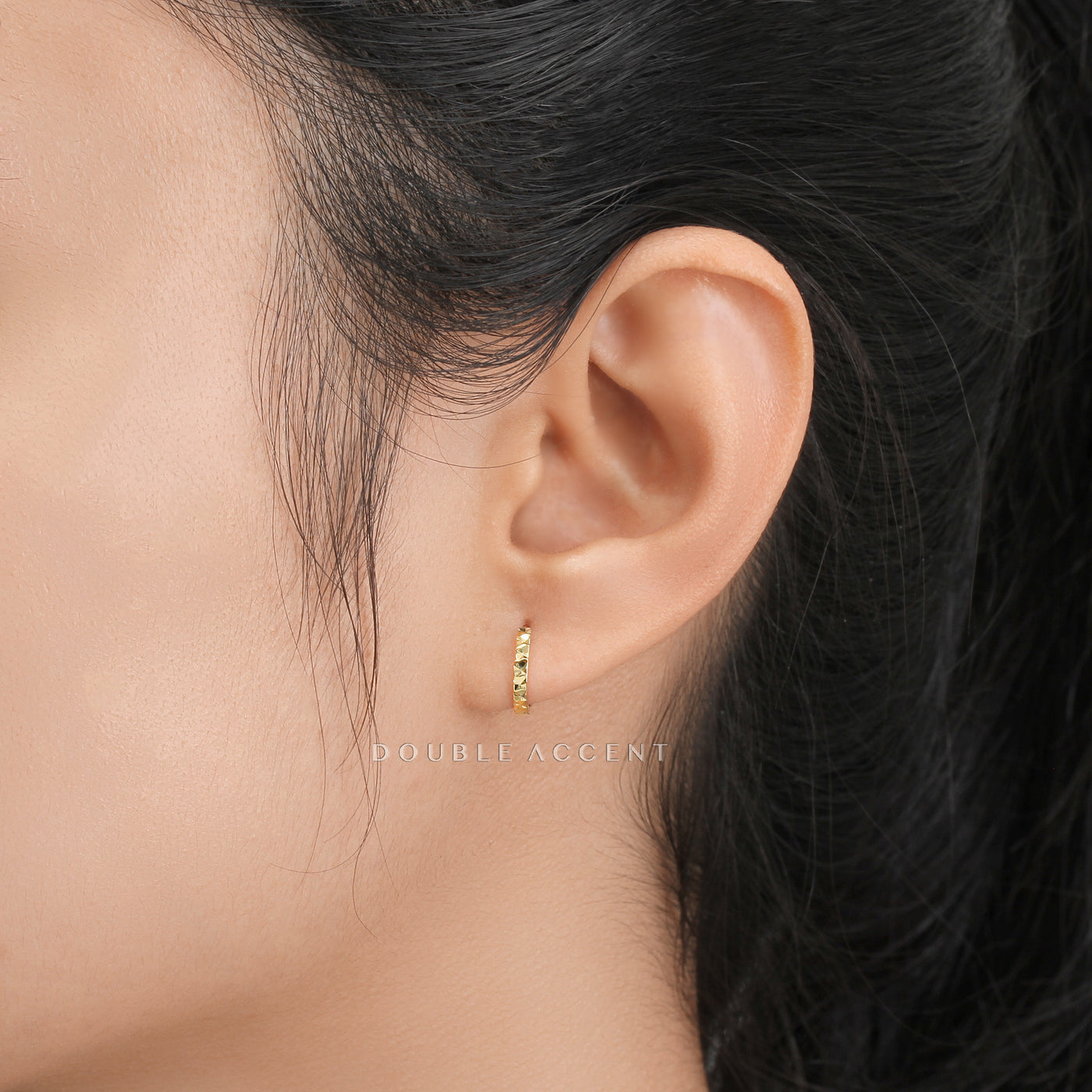 Close-up of Light Aura Huggies catching light