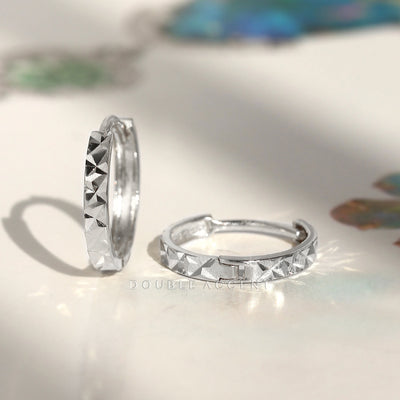 Diamond-cut 14K white gold mini huggie earrings