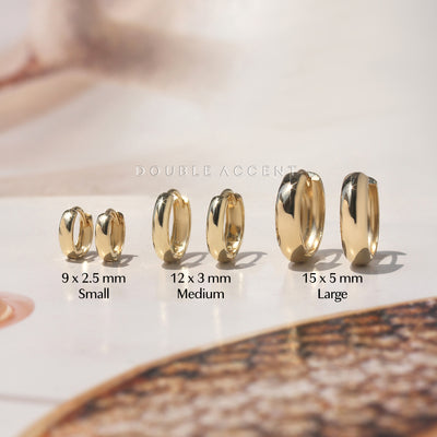Dome profile and polished finish shown for each size variation of gold huggie earrings – Double Accent