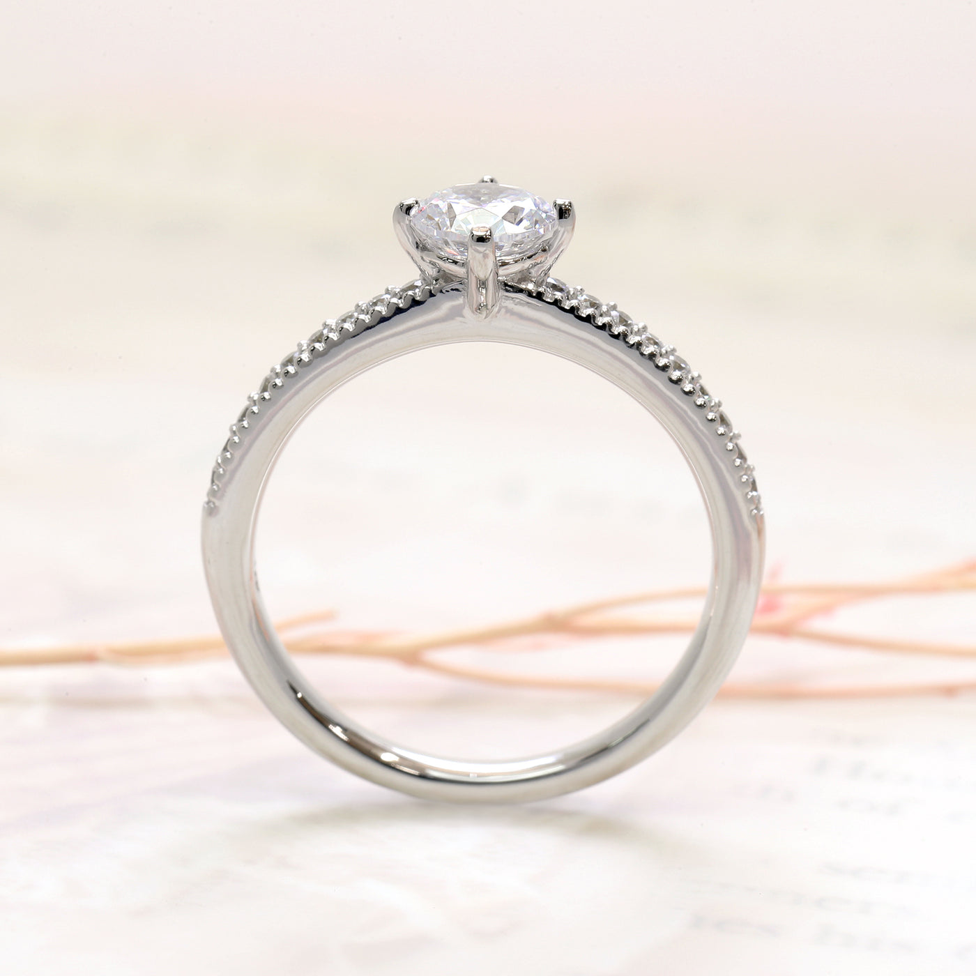 Close-up of 4-prong center setting and pavé shank