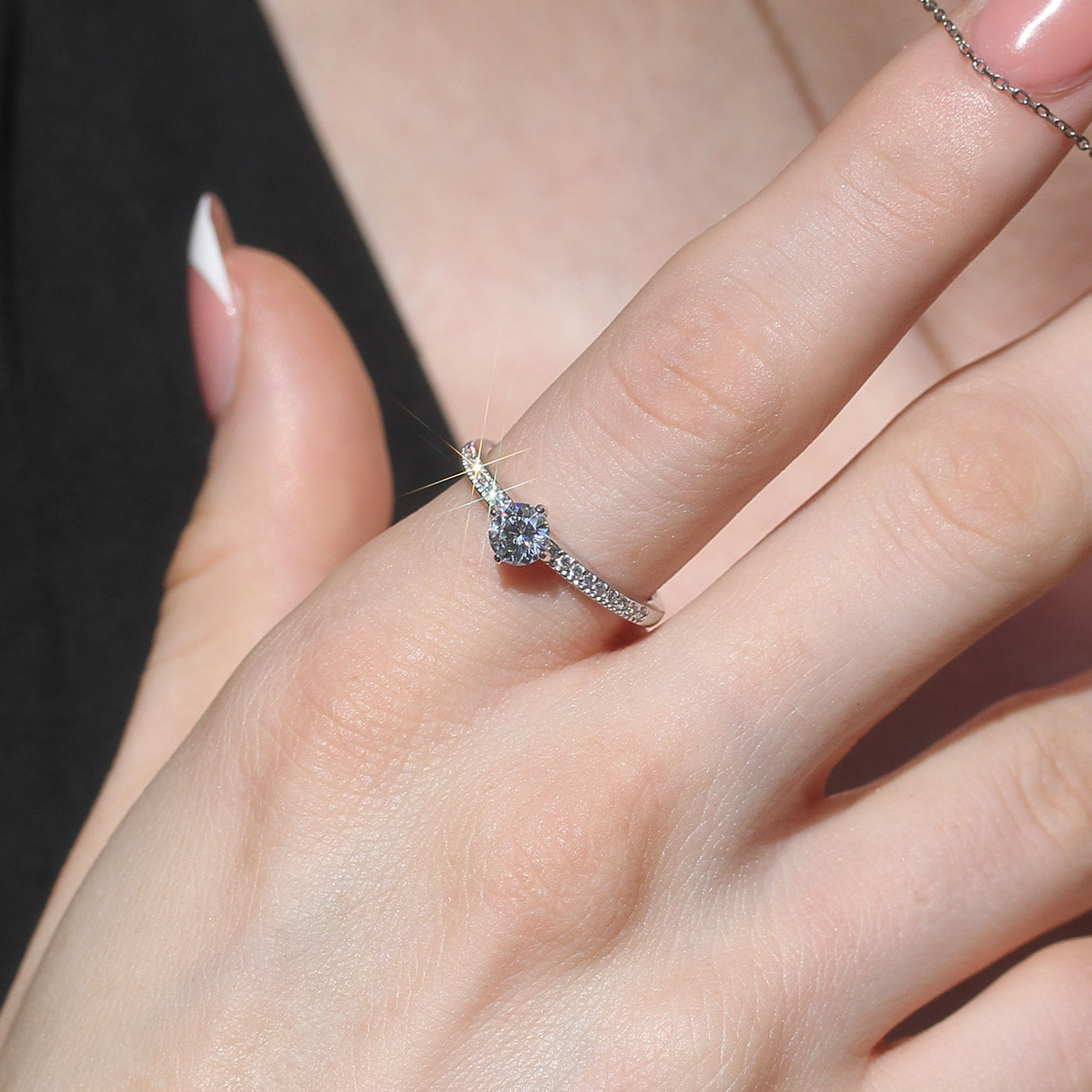 Dainty half-carat ring worn on hand, soft elegance