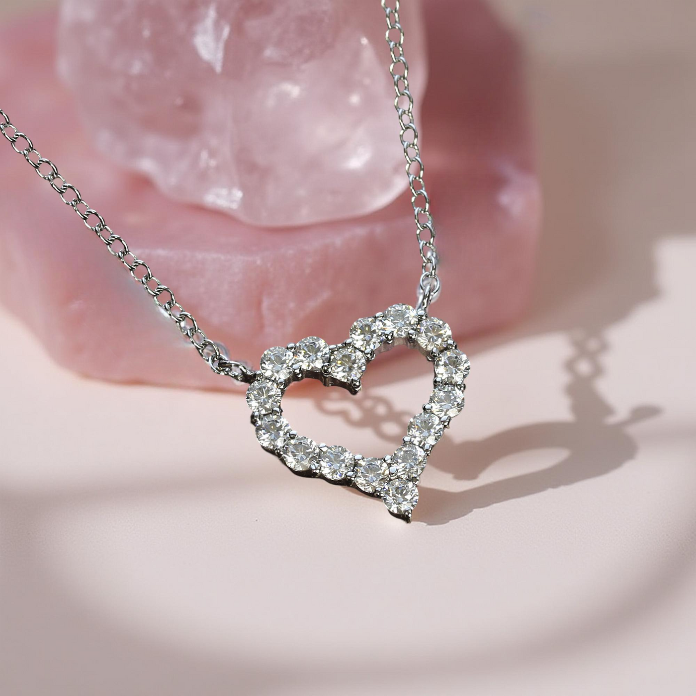 Side view of open heart necklace showing balanced shape and sparkle