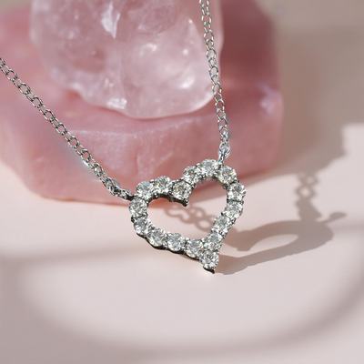 Side view of open heart necklace showing balanced shape and sparkle