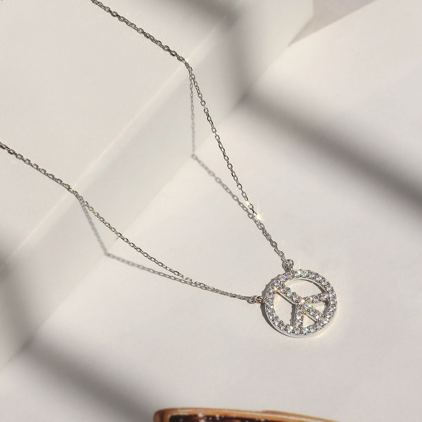 Zenith Peace Pendant Necklace with cubic zirconia pave peace sign in rhodium-plated sterling silver