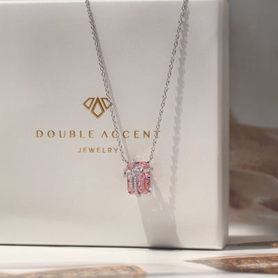 Blush Gift Pendant — sterling silver necklace with pink diamond-tone CZ and ribbon-like detail, gift-ready presentation