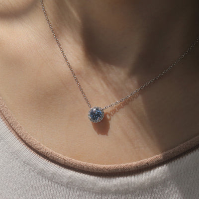 Gratitude Halo Necklace — sterling silver halo pendant with 1.2 carat CZ center, available in blue topaz