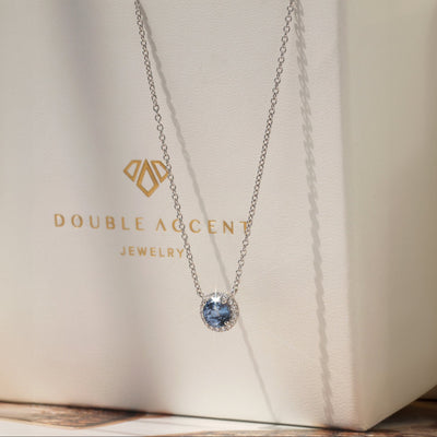 Gratitude Halo Necklace — sterling silver halo pendant with 1.2 carat CZ center, available in blue topaz