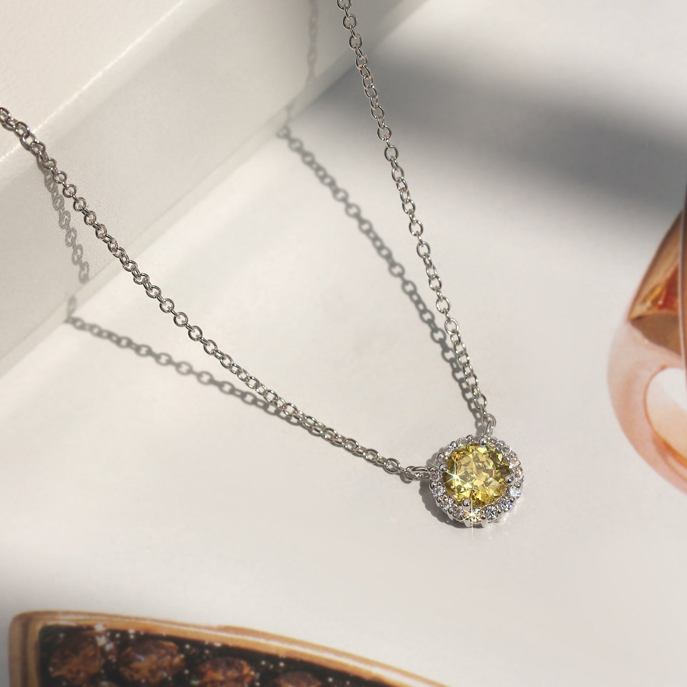 Gratitude Halo Necklace — sterling silver halo pendant with 1.2 carat CZ center, available in  yellow diamond tone