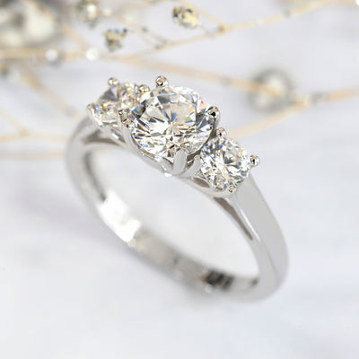 Rhodium-plated sterling silver three-stone ring with 1ct center cubic zirconia and two 0.25ct side stones — Trinity Grace Ring